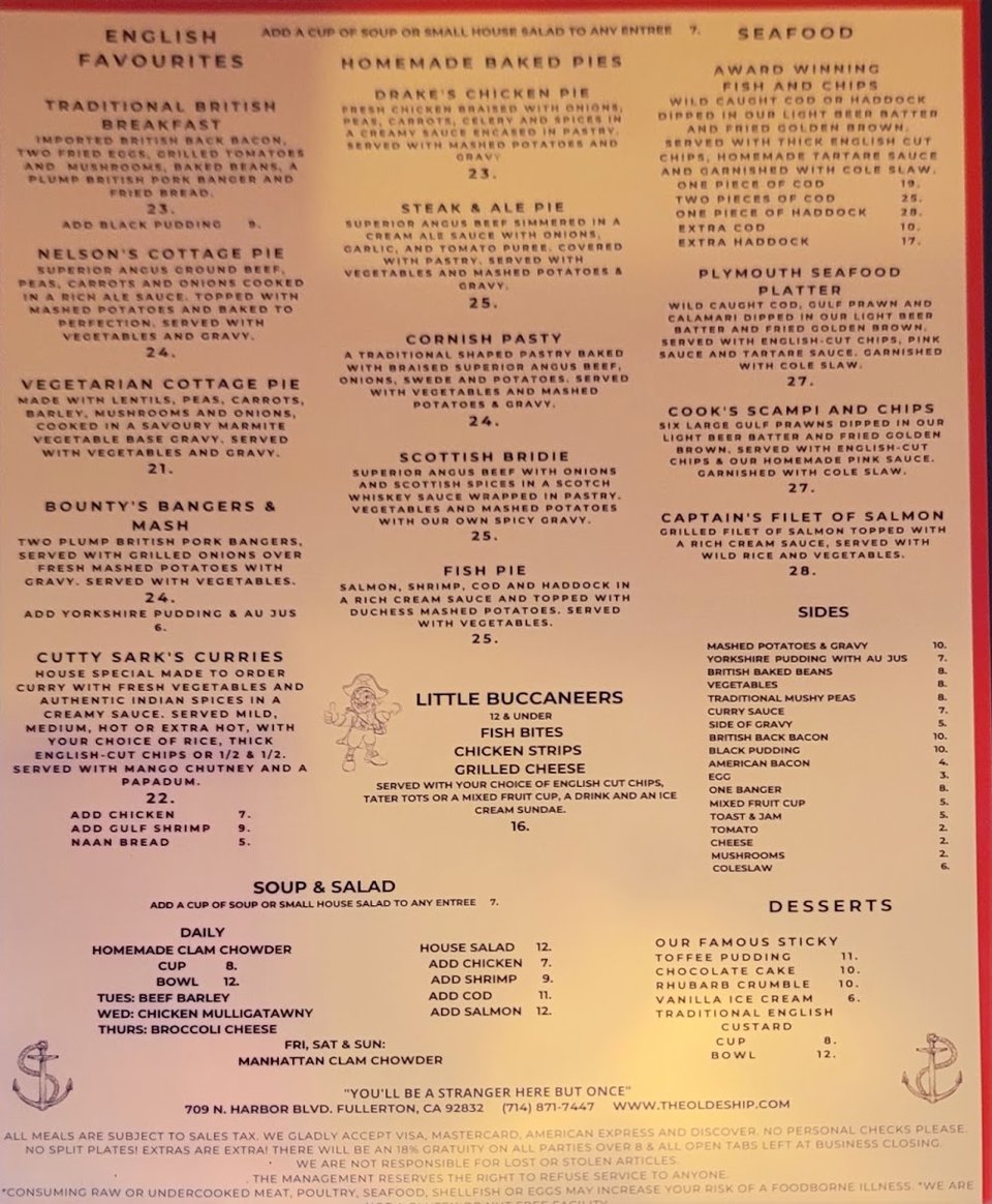 Printed menu with pub fare and beverage listings.